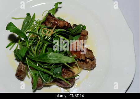 Pugliese di grigliata mista con insalata di rucola Foto Stock