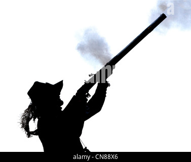 Silhouette di uomo fucile stooting Foto Stock