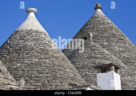 Italia Puglia Provincia di Bari, Alberobello, Trulli borrough (secco vecchi edifici in pietra con tetto in ardesia), elencato come Wolrd Heritage Foto Stock