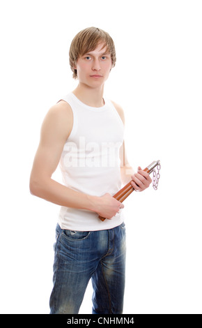 Arte Marziale. Uomo con nunchucks. Isolato su bianco. Foto Stock