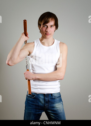 Arte Marziale. Uomo con nunchucks Foto Stock