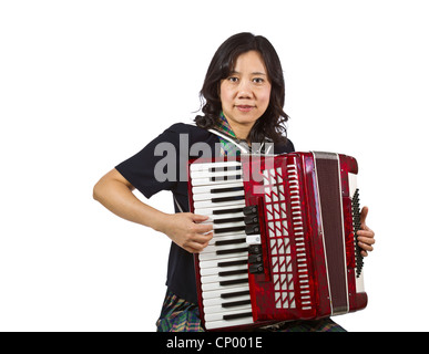 Donne asiatiche holding fisarmonica seduto su sfondo bianco Foto Stock