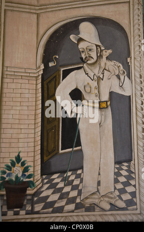 Murale di Uomo con cane sulla spalla in Bhagton Choti Ki Haveli, Shekhawati. Foto Stock