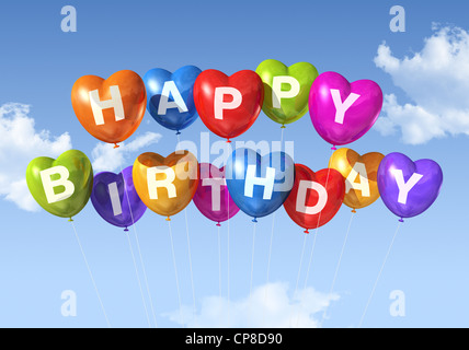 Colorato Buon Compleanno forma di cuore palloncini fluttuante nel cielo Foto Stock