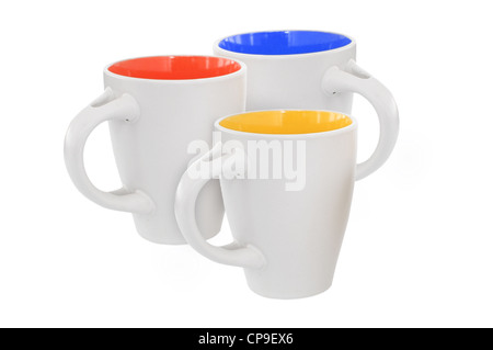 Tre tazze multicolori, isolato su bianco Foto Stock