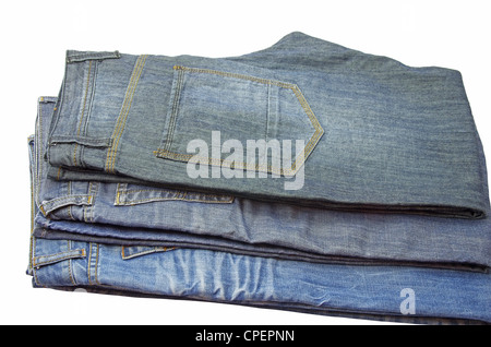 Ripiegate paia di jeans su bianco Foto Stock