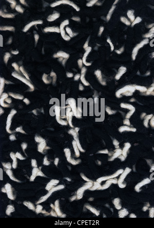 Macro di alta risoluzione di girato in bianco e nero le minacce di lana come una possibile immagine di sfondo. Foto Stock