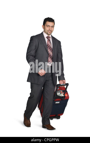 Imprenditore tenendo la valigia, ritratto Foto Stock