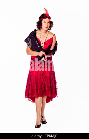 Una bruna donna pone come 1920's enca Foto Stock