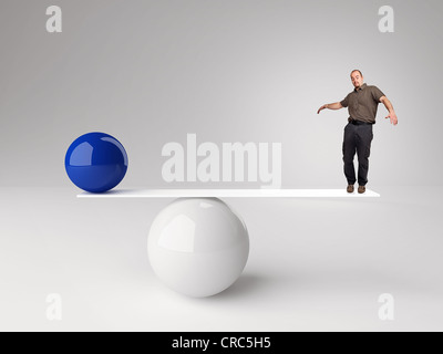 Immagine 3d di palla e uomo in falso equilibrio Foto Stock