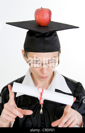 Simbolico per brainfood, titolare di laurea con Apple Foto Stock