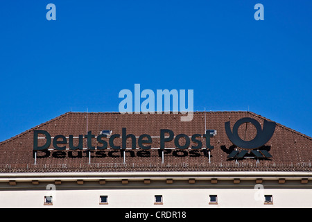 Deutsche Post logo con un corno postale, tedesco post office, filiale di Berlino in Germania, Europa Foto Stock