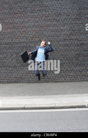 Business man jumping Foto Stock