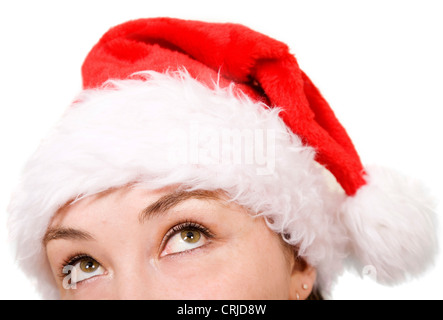Bella ragazza che indossa un cappello di Natale cercando Foto Stock
