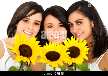 Tre sorridenti giovani donne con tre fiori di Sun Foto Stock