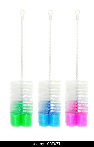 Tre bottiglie colorate spazzole su sfondo bianco Foto Stock