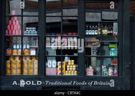 A. Oro cibi tradizionali della Gran Bretagna. Shop window display. 42 BRUSHFIELD ST, Spitalfields, Londra Foto Stock