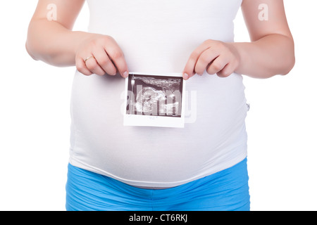 Donna incinta il ventre con immagine ecografica, primo piano Foto Stock