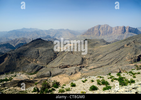 Western montagne Hajar dall'Altopiano Sayq, Oman Foto Stock