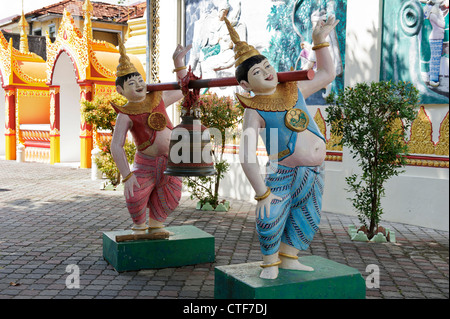 Ridendo bell portatori, Dhammikarama Tempio birmano, Georgetown, Penang, Malaysia. Foto Stock