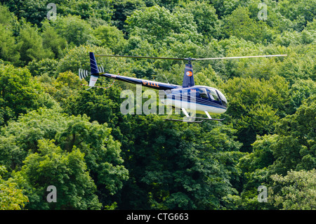 Robinson R-44 Raven II, G-XZXZ Foto Stock