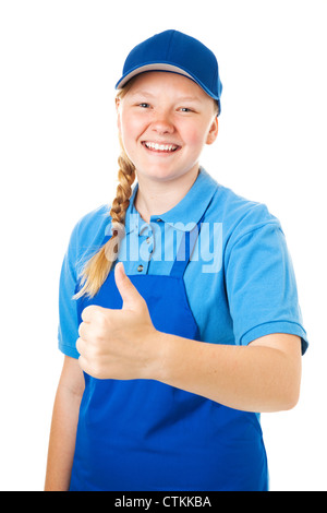 Bella bionda ragazza adolescente in un uniforme di lavoro, dando il pollice in alto segno. Isolato su bianco. Foto Stock