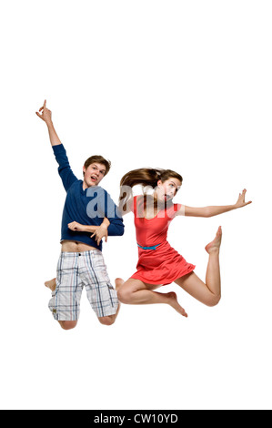 Due adolescenti Jumping Foto Stock