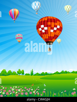 I palloni ad aria calda floating su campo verde Foto Stock