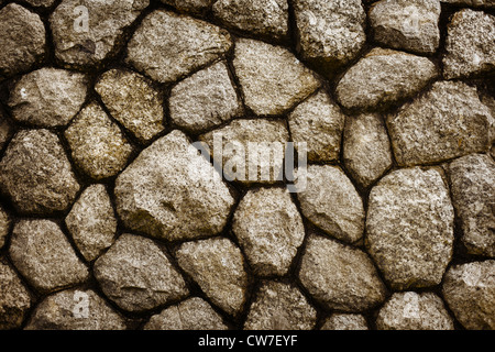 Vecchia pietra grezza muratura - uno sfondo naturale Foto Stock