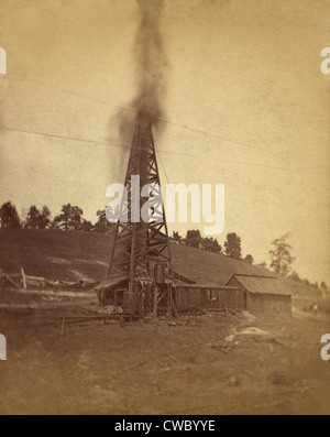 Gusher produca olio dalla cima di una torre di trivellazione al Lady Hunter ben vicino Città Petrolia, Pennsylvania. Ca. 1880 Foto Stock