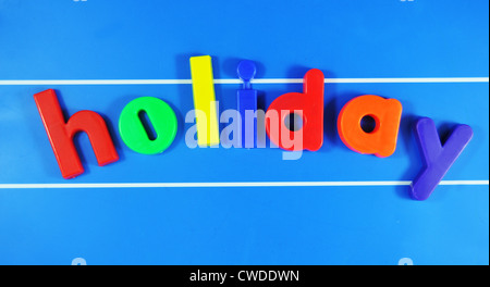 Holiday colorita parola sulla scheda magnetica Foto Stock