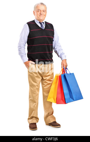 A piena lunghezza Ritratto di un uomo maturo con shopping bags isolati su sfondo bianco Foto Stock