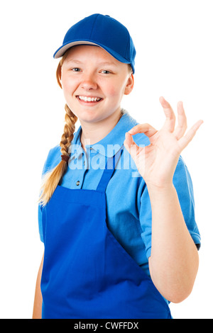 Ragazza con il suo primo lavoro, dando il segno va bene. Isolato su bianco. Foto Stock