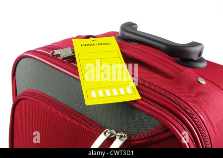 Red Travel Bag e giallo etichetta di destinazione Foto Stock