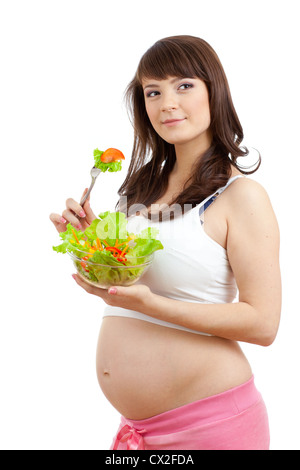 Donna incinta di mangiare cibo sano Foto Stock