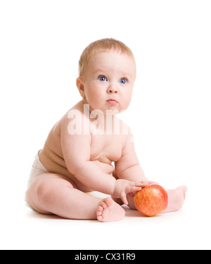 Baby boy seduta isolato con Apple Foto Stock