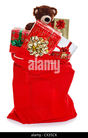 Natale Rosso sacco pieno di regalo presenta, isolato su sfondo bianco Foto Stock