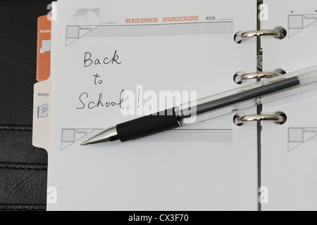 Si torna a scuola parole scritte su notebook Foto Stock