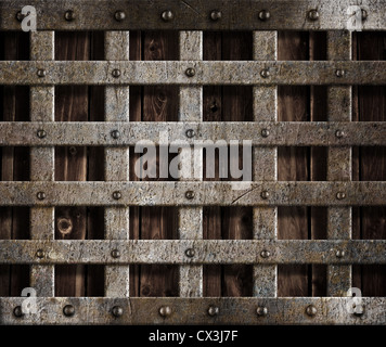 Gabbia metallica su uno sfondo di legno Foto Stock