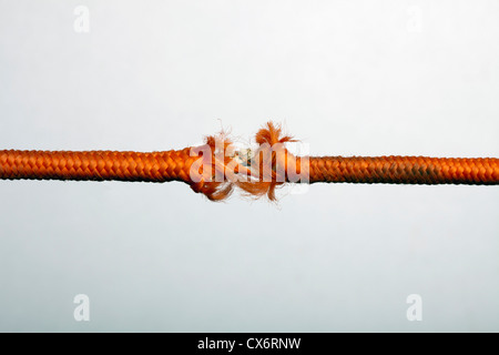 Una sfrangiatura corda arancione Foto Stock