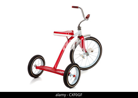 Triciclo rosso su sfondo bianco Foto Stock