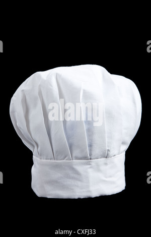 Un chef hat/cappello da cuoco di colore rosso su sfondo nero Foto Stock