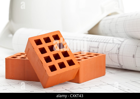 Mattone pietre sulla home progetti di costruzione - costruzione di casa o il concetto di costruzione Foto Stock