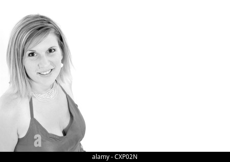 Giovane biondo busty woman in fashion shoot indossando un top rosa Foto Stock