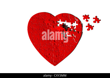 Cuore rosso a forma di puzzle jigsaw, incompleta Foto Stock