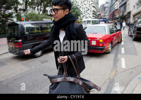Le persone nel centro di Hong Kong Foto Stock