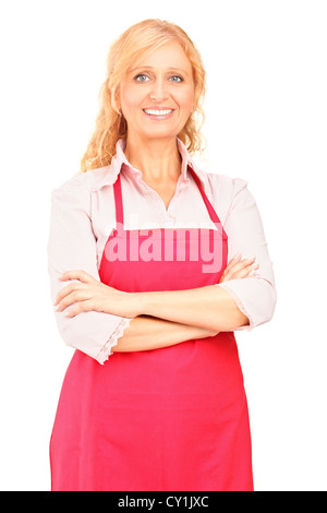 Una femmina di lavoratore manuale di indossare un grembiule e posa contro uno sfondo bianco Foto Stock