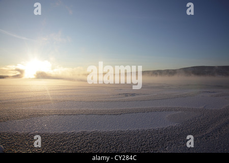 Clouds of steam rise over a freezing river on a very cold winter day in Sweden. Foto Stock