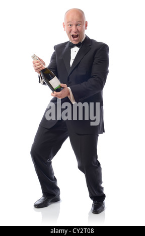 Uomo in smoking con una bottiglia di champagne vincere Foto Stock