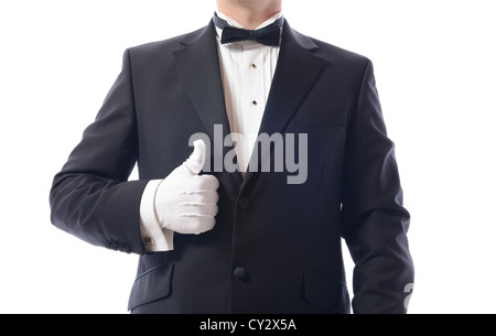 Uomo in smoking dando il pollice in alto isolato su bianco Foto Stock